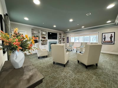 Common area with seating and decorative flowers