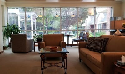 Common area with seating and a view of the garden