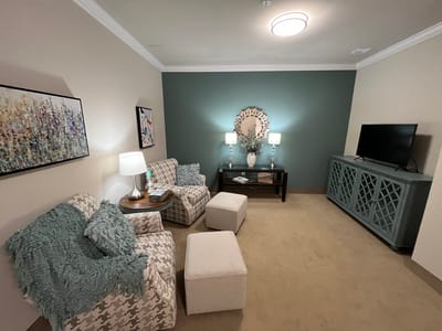 Brightly decorated common area with cozy seating