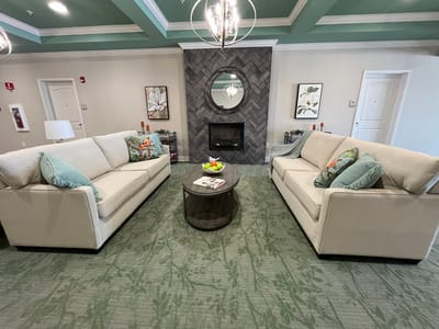 Bright common area with comfortable seating and decor