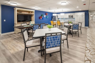 Bright common area with tables and chairs