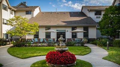 Outdoor space with a fountain and seating area