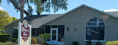Exterior view of the facility building with signage