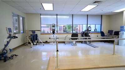 Physical therapy room with exercise equipment