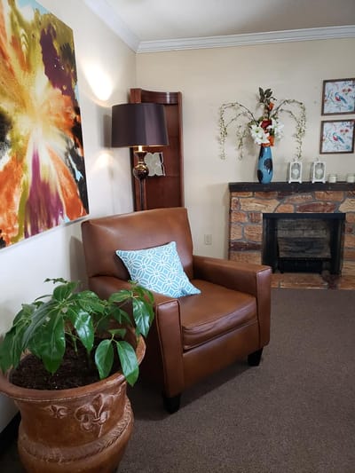 Cozy common area with chair and decorative elements