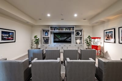 Comfortable common area with seating and a large TV