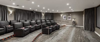 Interior of a cozy theater room with reclining seats