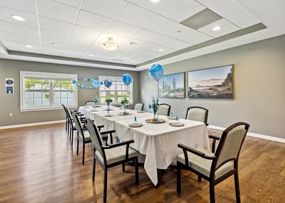 Dining area set up for a celebration with decorations