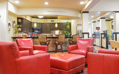 Cozy seating area in a common room with kitchen