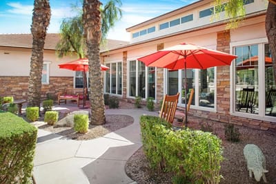 Outdoor seating area with umbrellas and walking path