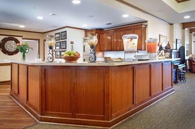 Interior view of a dining area with beverages and fruit.