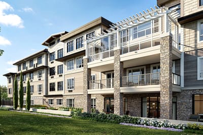 Exterior view of a senior living facility with landscaped gardens
