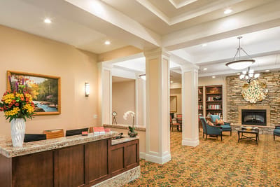 Bright lobby area with seating and a reception desk