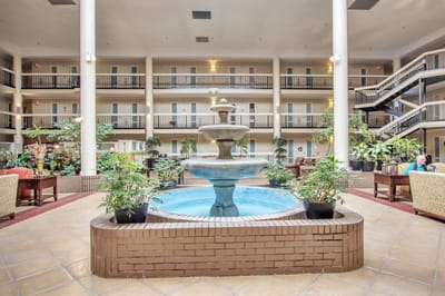 Interior view of a vibrant atrium with a fountain