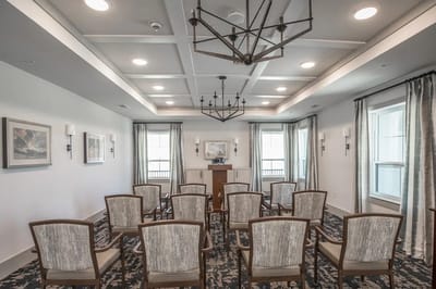 Bright activity room with chairs arranged in a circle