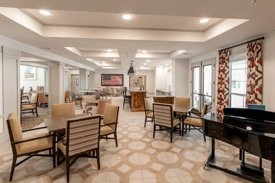 Bright common area with dining tables and seating