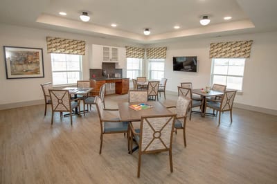 Bright common area with tables and chairs