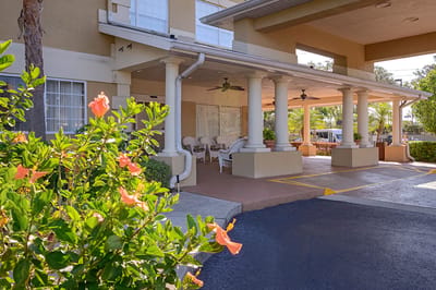 Entrance of the facility with blooming flowers