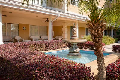 Outdoor courtyard with a fountain and seating area
