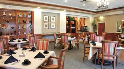 Interior view of a dining room with tables and chairs