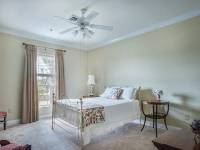 Cozy bedroom with floral bedding and natural light