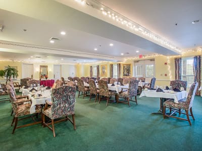 Bright dining room with tables set for a meal