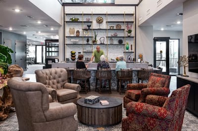 Residents and staff interacting in a welcoming common area