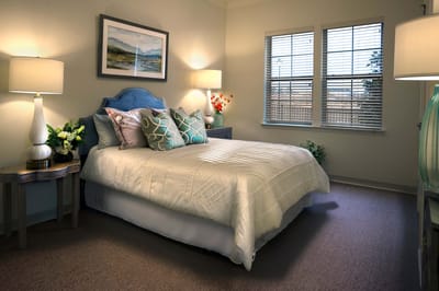 Cozy private room with a bed and decorative elements