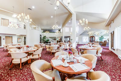 Dining area with tables set for breakfast