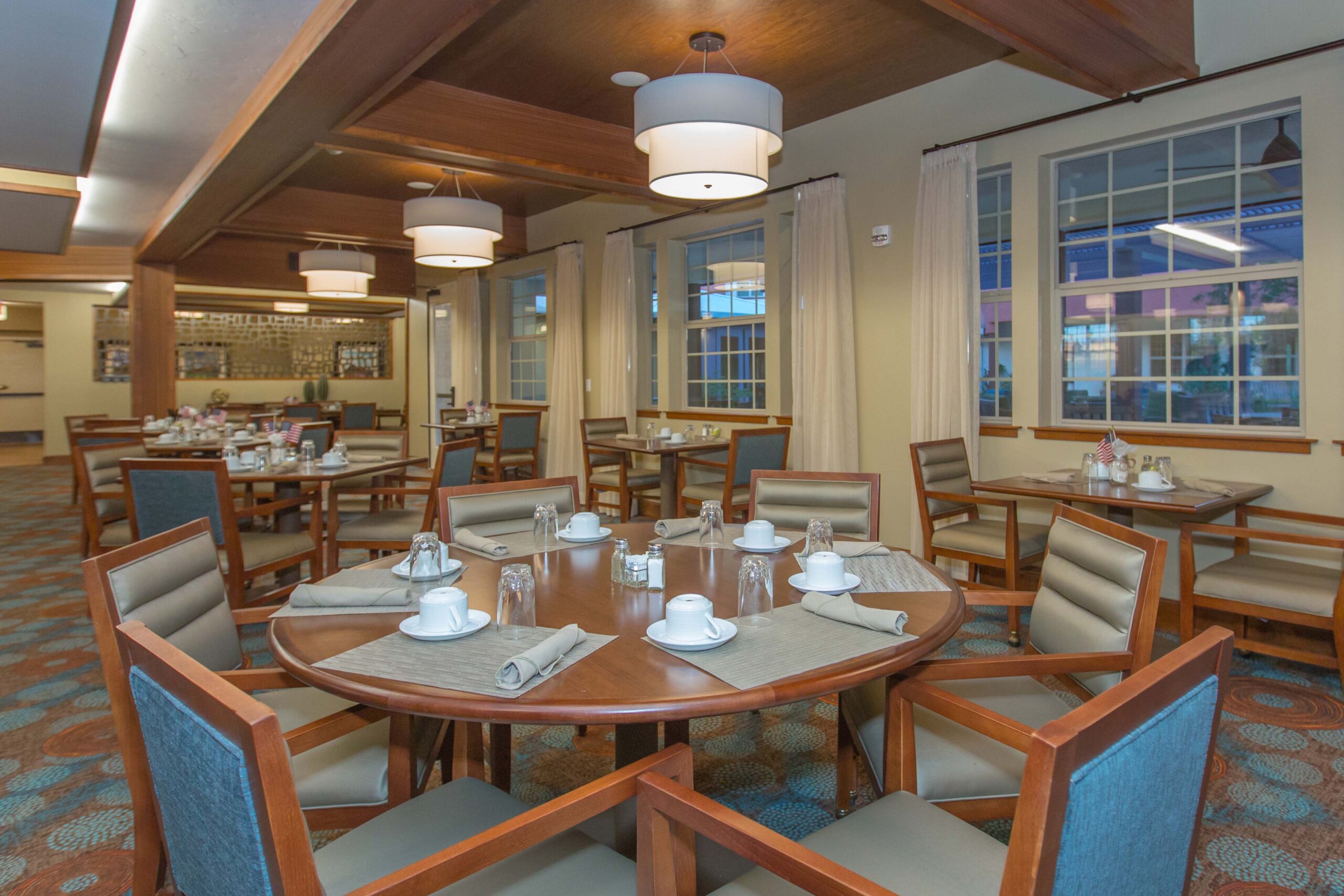 Dining area with tables set for residents