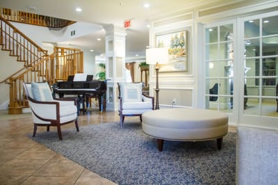 Cozy lounge area with seating and piano