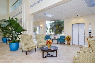 Bright lobby area with comfortable seating and plants