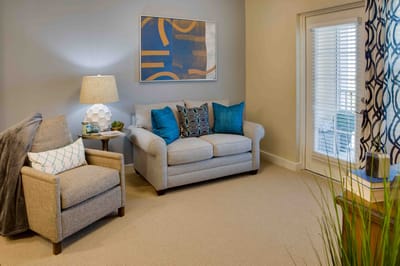 A cozy living room area with furnishings
