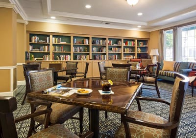 Cozy common area with bookshelves and seating