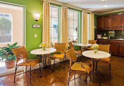 Bright common area with tables and chairs