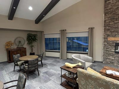 Bright interior common area with seating and windows