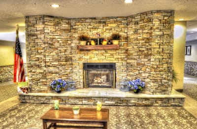 Interior common area with a stone fireplace and decorations