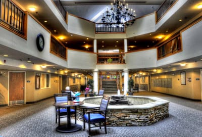 Interior view of a common area with seating and a fountain