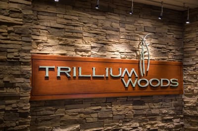 Facility logo displayed on a stone wall