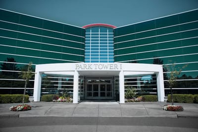 Exterior view of Park Tower I entrance with landscaping