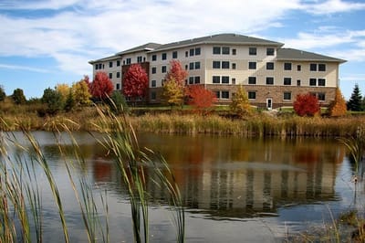Exterior view of Vicksburg Crossing by a pond