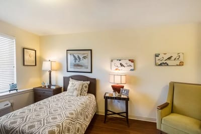 Cozy resident bedroom with artwork and furnishings
