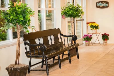Interior hallway with a bench and plants