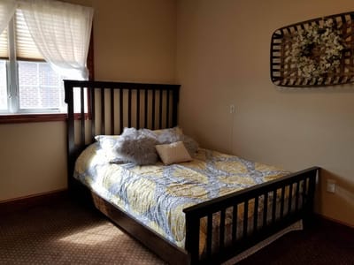 Private bedroom with a cozy bed and decorative accents