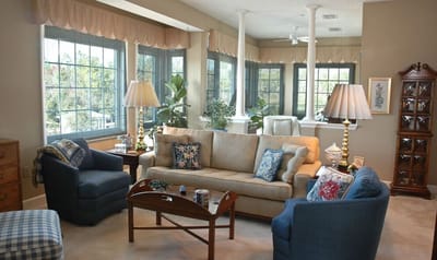 Cozy common area with comfortable seating and large windows