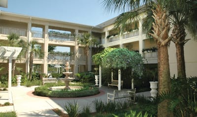 Outdoor courtyard with a fountain and seating