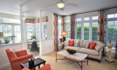 Bright common area with comfortable seating and green view