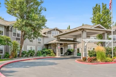 Entrance of Woodside Senior Living facility with landscape