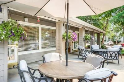 Outdoor seating area with flowers and umbrellas