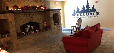 Cozy common area with fireplace and holiday decor